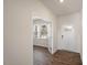 Bright entryway with hardwood floors and French doors leading to an office at 264 Hawksmoore Ln, Lillington, NC 27546