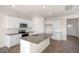 Modern kitchen with granite countertops and stainless steel appliances at 264 Hawksmoore Ln, Lillington, NC 27546