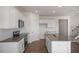 Spacious kitchen with granite countertops and stainless steel appliances at 264 Hawksmoore Ln, Lillington, NC 27546