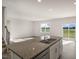 Modern kitchen with granite countertops and stainless steel appliances at 264 Hawksmoore Ln, Lillington, NC 27546