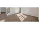 Sunlit living room with hardwood floors and staircase at 264 Hawksmoore Ln, Lillington, NC 27546