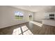 Spacious living area with hardwood floors and access to patio at 264 Hawksmoore Ln, Lillington, NC 27546