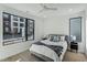 Bright bedroom with a queen bed and large windows at 29 Enterprise St # 108, Raleigh, NC 27607