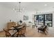 Open concept living and dining area with hardwood floors at 29 Enterprise St # 108, Raleigh, NC 27607