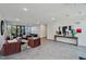 Well-lit lobby features modern furniture, artwork, and access to outdoor seating area, perfect for residents and guests at 29 Enterprise St # 108, Raleigh, NC 27607