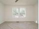 Bedroom with two windows and a view of the backyard at 3050 Bennett Siler City Rd, Bennett, NC 27208
