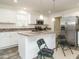 Kitchen island with granite countertop and seating for two at 3050 Bennett Siler City Rd, Bennett, NC 27208