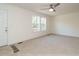 Bright living room with carpeted floor and large windows at 3050 Bennett Siler City Rd, Bennett, NC 27208