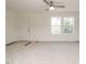 Spacious living room with carpeted floors and a ceiling fan at 3050 Bennett Siler City Rd, Bennett, NC 27208