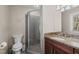 Clean bathroom with a shower, granite vanity, and toilet at 321 Old Fox Trl, Durham, NC 27713