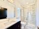 The bathroom features geometric tiles in the shower, and black hardware at 3315 Hampton Rd, Raleigh, NC 27607