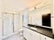 The bathroom has gray tile, a white subway-tile shower, and black hardware at 3315 Hampton Rd, Raleigh, NC 27607