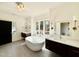 Bright bathroom with dual sinks, soaking tub, and modern fixtures at 3315 Hampton Rd, Raleigh, NC 27607