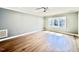 Spacious bedroom featuring hardwood floors, a ceiling fan, and natural light at 3315 Hampton Rd, Raleigh, NC 27607