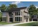 Two-story house featuring a brick and vinyl exterior with large windows and a well-manicured lawn at 3315 Hampton Rd, Raleigh, NC 27607
