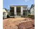 Modern two-story home with large windows and a brick facade, awaiting landscaping at 3315 Hampton Rd, Raleigh, NC 27607