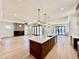 Bright, open-concept kitchen with large island, pendant lighting, and seamless flow to the living area at 3315 Hampton Rd, Raleigh, NC 27607