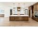 Spacious kitchen with a large center island, quartz countertops, and modern pendant lighting at 3315 Hampton Rd, Raleigh, NC 27607
