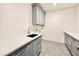 This laundry room features stylish gray cabinets and a granite countertop at 3315 Hampton Rd, Raleigh, NC 27607