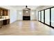 Bright living room with fireplace, adjacent wet bar, and large sliding doors at 3315 Hampton Rd, Raleigh, NC 27607