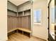 Mudroom with custom storage including bench, hooks, and overhead cabinets at 3315 Hampton Rd, Raleigh, NC 27607