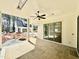 Covered patio features stone floors, a ceiling fan, and sliding glass doors at 3315 Hampton Rd, Raleigh, NC 27607