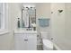 The clean bathroom is equipped with a glass shower, vanity, and updated toilet at 3317 Hampton Rd, Raleigh, NC 27607