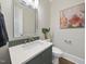 Bathroom featuring modern fixtures, stylish mirror, vanity, and elegant decor, creating a luxurious space at 3317 Hampton Rd, Raleigh, NC 27607
