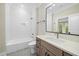 A renovated bathroom with bright white subway tiles, modern vanity and brushed metal fixtures at 3317 Hampton Rd, Raleigh, NC 27607