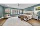 This bedroom features stylish decor, hardwood floors, and refreshing natural light at 3317 Hampton Rd, Raleigh, NC 27607