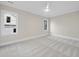 Bedroom featuring two windows, neutral paint, and carpeted floors at 3317 Hampton Rd, Raleigh, NC 27607