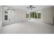 Bright bedroom boasts a ceiling fan and many windows offering plenty of natural light and outside views at 3317 Hampton Rd, Raleigh, NC 27607