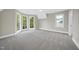 A large bedroom with a beautiful bay window, neutral paint, and a ceiling fan at 3317 Hampton Rd, Raleigh, NC 27607