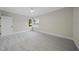 Neutral bedroom featuring a ceiling fan and windows offering plenty of light at 3317 Hampton Rd, Raleigh, NC 27607