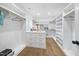 Walk-in closet with custom shelving, drawers, and hardwood flooring at 3317 Hampton Rd, Raleigh, NC 27607