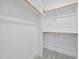 A walk-in closet with custom shelving and carpeted floors at 3317 Hampton Rd, Raleigh, NC 27607