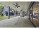 Covered patio with stone flooring, ceiling fans, and a built-in outdoor kitchen for entertaining at 3317 Hampton Rd, Raleigh, NC 27607