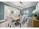 Formal dining area is complete with an elegant chandelier, beautiful rug, and seating for eight at 3317 Hampton Rd, Raleigh, NC 27607