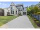 Stunning two-story home features a modern gray exterior, manicured lawn, and an inviting driveway at 3317 Hampton Rd, Raleigh, NC 27607