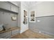Hallway features a storage bench and wall cabinets, and beautiful hardwood floors at 3317 Hampton Rd, Raleigh, NC 27607