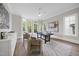 Home office featuring a large bay window, stylish decor, and wood floors at 3317 Hampton Rd, Raleigh, NC 27607
