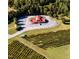 Aerial view of vineyard with a large red building at 40 Shay St, Angier, NC 27501