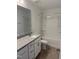 Bathroom with single vanity, granite countertop, and tub shower combo at 40 Shay St, Angier, NC 27501
