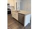 Kitchen island with granite countertop, sink, and dishwasher at 40 Shay St, Angier, NC 27501