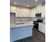 Spacious kitchen with white cabinets, granite countertops, and stainless steel appliances at 40 Shay St, Angier, NC 27501
