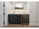 Stylish home bar featuring dark cabinets, marble countertop, and a wine refrigerator at 4005 Brevard Pl, Raleigh, NC 27609