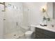 Modern bathroom featuring a tiled glass shower, marble countertops, and sleek fixtures at 4005 Brevard Pl, Raleigh, NC 27609