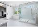Luxurious bathroom featuring a soaking tub, glass shower, and stylish barn door at 4005 Brevard Pl, Raleigh, NC 27609