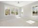 Bright and airy bedroom filled with natural light through many windows and neutral carpet at 4005 Brevard Pl, Raleigh, NC 27609