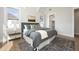 Bright bedroom with vaulted ceilings, hardwood floors, and stylish decor at 4005 Brevard Pl, Raleigh, NC 27609
